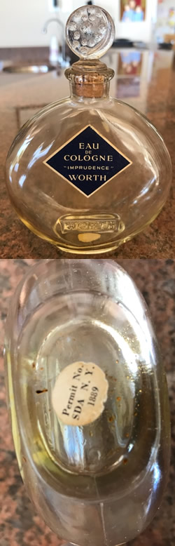 Close Copy Of Je Reviens-5 Perfume Bottle For Worth Marked With Sliver Moon and Stars Stopper And Molded WORTH To The Front Face. Believed Made For Worth By An Unknown U.S. Glassmaker During The War With Cork Stoppe Unsigned. Also Showing White Label On Underside. Close Copy Of Je Reviens-5 Perfume Bottle For Worth Marked With Sliver Moon and Stars Stopper And Molded WORTH To The Front Face. Believed Made For Worth By An Unknown U.S. Glassmaker During The War With Cork Stopper. Unsigned. Also Showing White Label On Underside.
