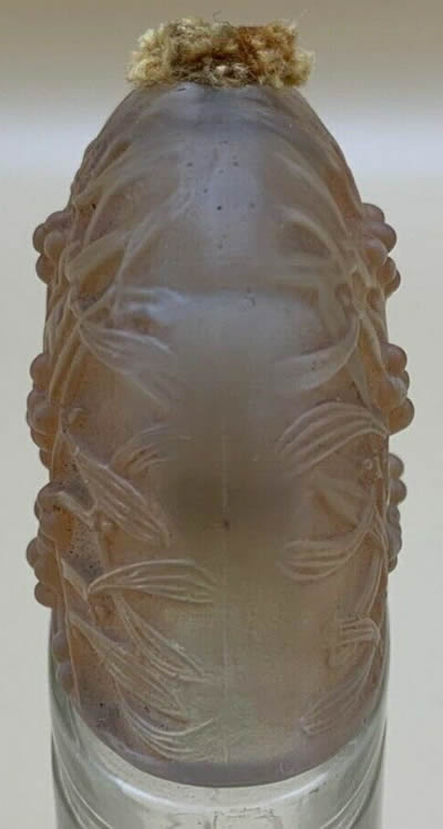 Sous Le Gui Perfume Bottle Elongated Dome Shaped Cover Side View Designed By André Jolivette In 1924 for Jean De Parys and later replaced by a more refined and coherent René Lalique Cover In 1926 Sous Le Gui Perfume Bottle Elongated Dome Shaped Cover Side View Designed By André Jolivette In 1924 for Jean De Parys and later replaced by a more refined and coherent René Lalique Cover In 1926